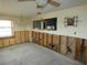 Dining room with significant water damage and exposed walls needing repair at 13737 Michelle Ave, Hudson, FL 34667