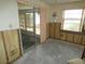 Dining room with water damage and exposed walls; needs complete renovation at 13737 Michelle Ave, Hudson, FL 34667