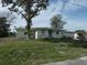 Ranch style home with a large yard and mature tree at 13737 Michelle Ave, Hudson, FL 34667