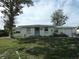 Ranch style home with a large yard and mature tree at 13737 Michelle Ave, Hudson, FL 34667