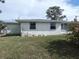 Rear view of the house showing the screened porch at 13737 Michelle Ave, Hudson, FL 34667
