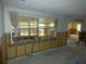A living room with extensive water damage and exposed walls requiring repair at 13737 Michelle Ave, Hudson, FL 34667
