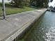 Concrete seawall with riprap along the water's edge at 13737 Michelle Ave, Hudson, FL 34667