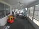 Sunroom with windows and seating area at 13737 Michelle Ave, Hudson, FL 34667