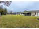 Large backyard with grassy area at 1378 Haulover Ave, Spring Hill, FL 34608