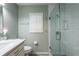 Modern bathroom with a large walk-in shower and updated fixtures at 1378 Haulover Ave, Spring Hill, FL 34608