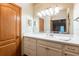 Elegant bathroom with double vanity, large mirror, and updated cabinets at 1378 Haulover Ave, Spring Hill, FL 34608