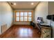 Bright home office with hardwood floors and large window at 1378 Haulover Ave, Spring Hill, FL 34608