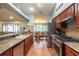 Updated kitchen with granite countertops and stainless steel appliances at 1378 Haulover Ave, Spring Hill, FL 34608