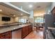 Modern kitchen with granite countertops and stainless steel appliances at 1378 Haulover Ave, Spring Hill, FL 34608