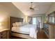 Spacious main bedroom with hardwood floors and access to backyard at 1378 Haulover Ave, Spring Hill, FL 34608