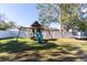 Spacious backyard with playset, providing with plenty of space to play at 14004 Cascade Ln, Tampa, FL 33618