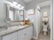 Main bathroom, granite countertop, white cabinets and shower at 14004 Cascade Ln, Tampa, FL 33618