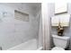 Bathroom with marble tile and a bathtub at 14004 Cascade Ln, Tampa, FL 33618