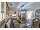 Bright dining area, featuring a wooden table and a rustic-chic wall at 14004 Cascade Ln, Tampa, FL 33618