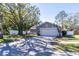 House with a large tree, white fence, and basketball hoop in the front yard at 14004 Cascade Ln, Tampa, FL 33618