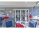 French doors leading to a relaxing screened porch at 14004 Cascade Ln, Tampa, FL 33618