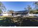 House exterior with solar panels and a large backyard at 14004 Cascade Ln, Tampa, FL 33618