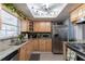 Modern kitchen with stainless steel appliances and granite countertops at 14004 Cascade Ln, Tampa, FL 33618