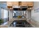 Kitchen boasts granite counters and stainless steel appliances at 14004 Cascade Ln, Tampa, FL 33618