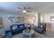 Spacious living room featuring a cozy seating area and decorative wall accents at 14004 Cascade Ln, Tampa, FL 33618