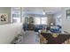 Living area featuring blue sofas, a decorative rug, and stylish decor at 14004 Cascade Ln, Tampa, FL 33618