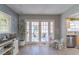 Living area with French doors leading to the backyard at 14004 Cascade Ln, Tampa, FL 33618