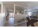 Open living room with gray walls, hardwood floors, and a half wall at 14004 Cascade Ln, Tampa, FL 33618