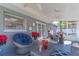 Relaxing screened porch with wicker furniture, perfect for enjoying Florida evenings at 14004 Cascade Ln, Tampa, FL 33618