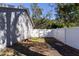 Side yard with white fence and gate at 14004 Cascade Ln, Tampa, FL 33618