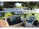 Cozy backyard patio with seating and fenced yard at 15439 Stone House Dr, Brooksville, FL 34604