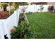 Landscaped backyard with lush grass and garden at 15439 Stone House Dr, Brooksville, FL 34604