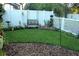 Landscaped backyard with lush grass and garden at 15439 Stone House Dr, Brooksville, FL 34604