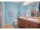 Double vanity bathroom with a large mirror and a walk-in shower at 15439 Stone House Dr, Brooksville, FL 34604