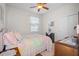 Bedroom with a pastel quilt and wood furniture at 15439 Stone House Dr, Brooksville, FL 34604