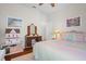 Bedroom with a pastel quilt and antique vanity at 15439 Stone House Dr, Brooksville, FL 34604