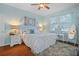 Bright bedroom with a floral comforter and a white dresser at 15439 Stone House Dr, Brooksville, FL 34604