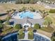 Aerial view of community pool with surrounding lounge areas at 15439 Stone House Dr, Brooksville, FL 34604