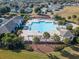 Aerial view of community pool with cabanas and landscaping at 15439 Stone House Dr, Brooksville, FL 34604