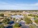 Aerial view of community pool, playground, and homes at 15439 Stone House Dr, Brooksville, FL 34604