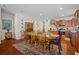 Bright dining room with hardwood floors and a view of the kitchen at 15439 Stone House Dr, Brooksville, FL 34604