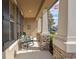 Relaxing front porch with rocking chair and view of the neighborhood at 15439 Stone House Dr, Brooksville, FL 34604