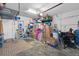 Organized garage with overhead storage and shelving at 15439 Stone House Dr, Brooksville, FL 34604