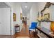 Long hallway with hardwood floors and access to other rooms at 15439 Stone House Dr, Brooksville, FL 34604
