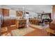 Open kitchen boasts an island, hardwood floors, and stainless steel appliances at 15439 Stone House Dr, Brooksville, FL 34604