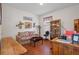 Home office with a wooden desk, comfortable couch and built-in shelves at 15439 Stone House Dr, Brooksville, FL 34604