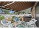 Relaxing patio with hot tub, seating, and covered area at 15439 Stone House Dr, Brooksville, FL 34604