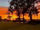 Sunset view over the water from the backyard at 1624 Sea Breeze Dr, Tarpon Springs, FL 34689