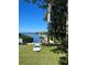 Private dock with paddleboard on the water at 1624 Sea Breeze Dr, Tarpon Springs, FL 34689