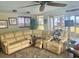 Spacious living room with large sectional sofa and view of the backyard at 1624 Sea Breeze Dr, Tarpon Springs, FL 34689